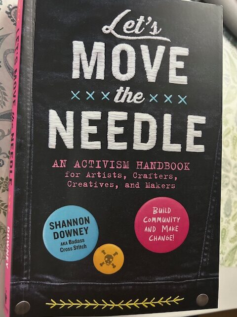 A picture of a book that says Let's Move the Need An Activisim Handbook for Artists, Crafters, Creatives and Makers. Build Community and Make Change. By Shannon Downey. 